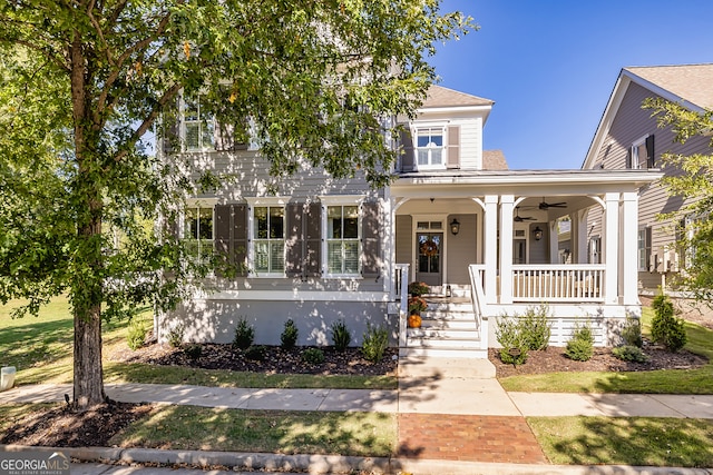 view of front of home with ceiling fan and a porch