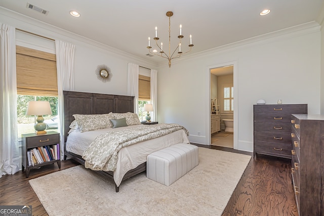 bedroom featuring connected bathroom, ornamental molding, a chandelier, and dark hardwood / wood-style floors