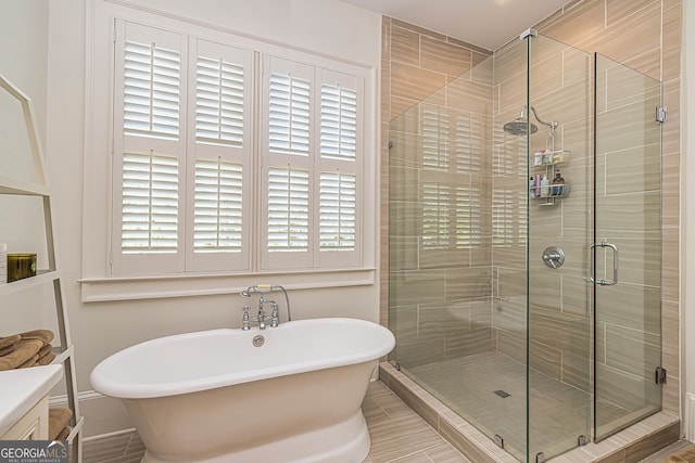 bathroom with independent shower and bath