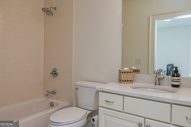 full bathroom featuring vanity, toilet, and tiled shower / bath