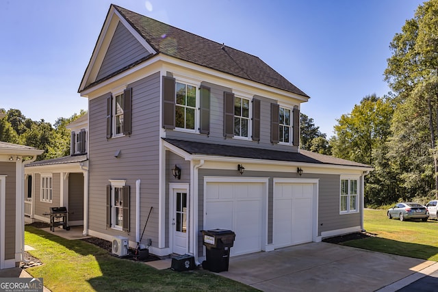 view of home's exterior with a yard and a garage