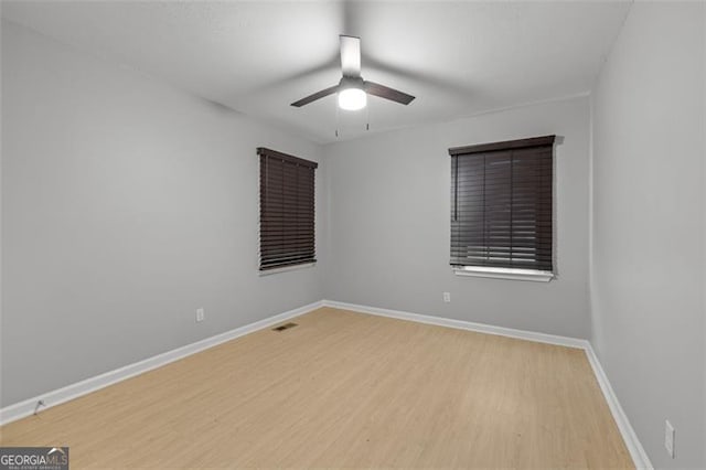 unfurnished room with light hardwood / wood-style floors and ceiling fan