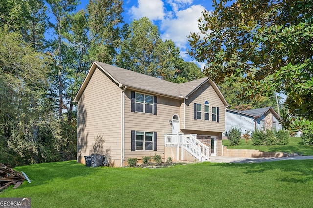 raised ranch featuring a front yard