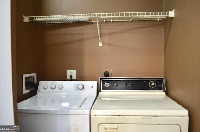 laundry room featuring washing machine and dryer