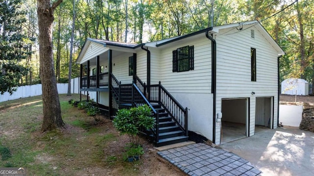 view of front facade featuring a porch and a garage