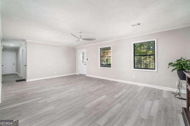 unfurnished living room with crown molding, light hardwood / wood-style flooring, and ceiling fan