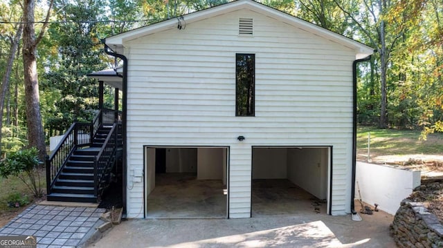 back of house with a garage