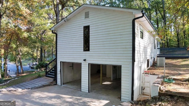 view of side of home featuring central AC unit