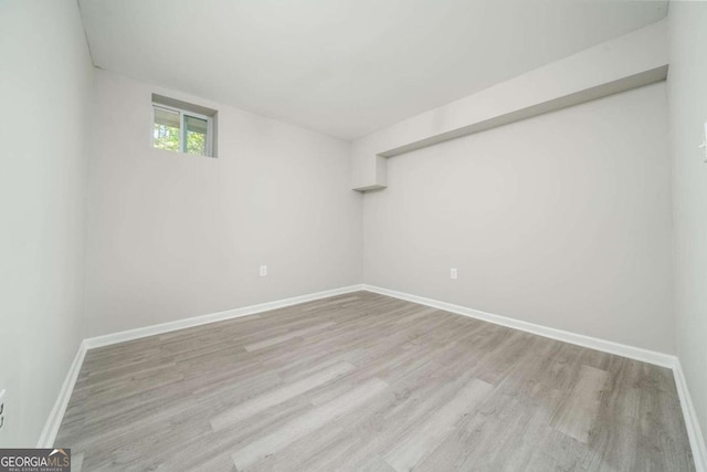 basement featuring light hardwood / wood-style floors