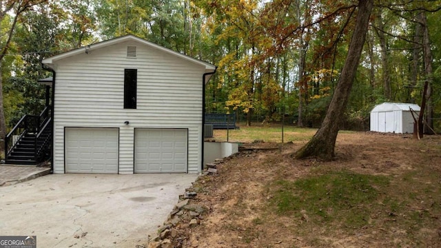 view of side of property with a storage unit