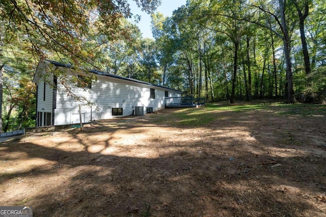 view of yard with central AC