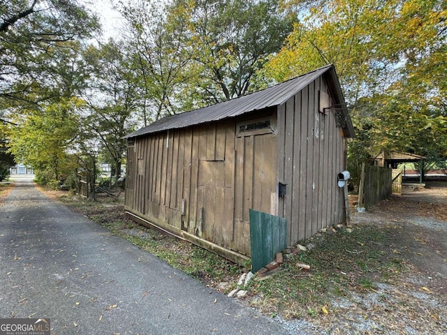 view of outbuilding featuring a carport