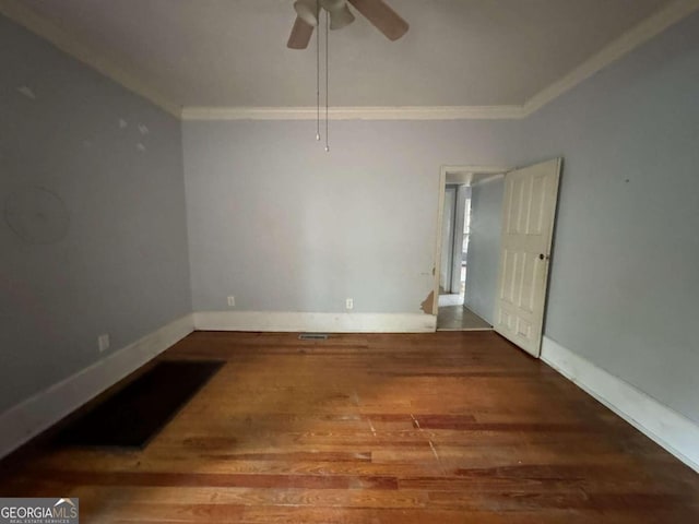 unfurnished room with ornamental molding, wood-type flooring, and ceiling fan