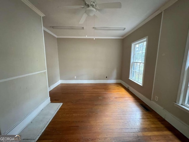 spare room with ornamental molding, ceiling fan, and dark hardwood / wood-style flooring