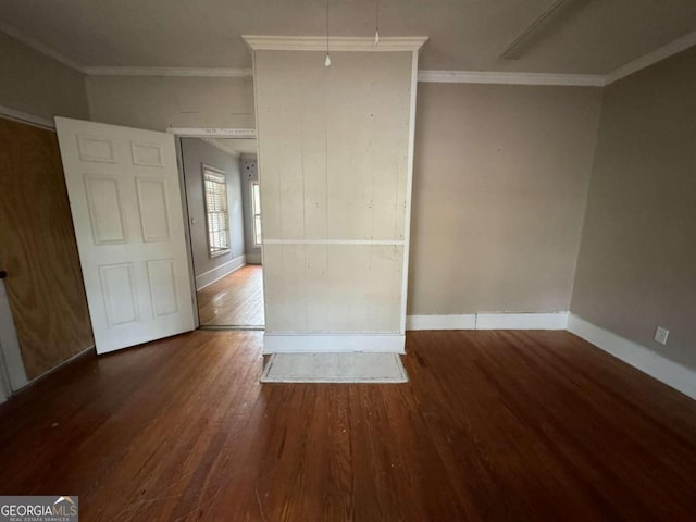 unfurnished room with wood-type flooring and ornamental molding