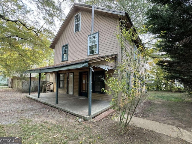 back of house with a patio