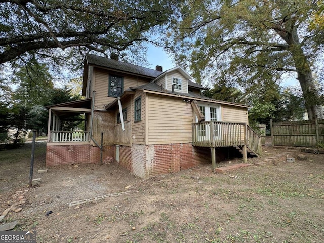 rear view of property with a deck