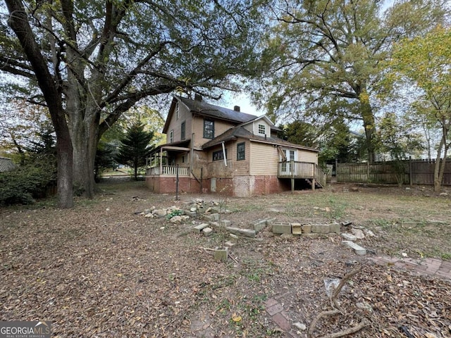 view of home's exterior with a wooden deck