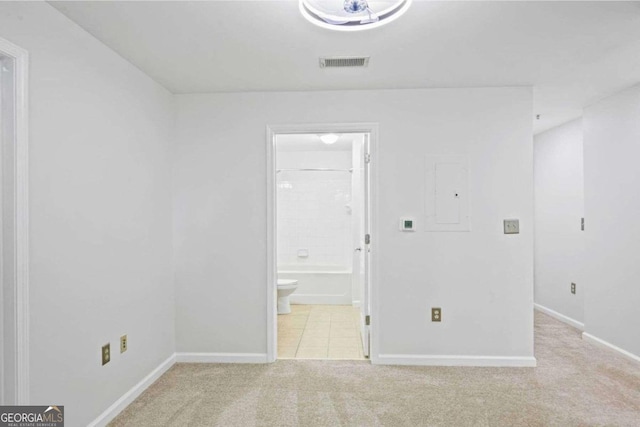 carpeted empty room featuring electric panel