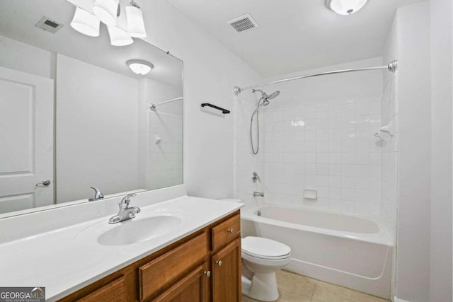 full bathroom with vanity, toilet, tile patterned floors, and tiled shower / bath combo