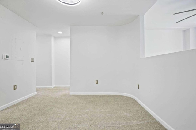 carpeted empty room featuring ceiling fan