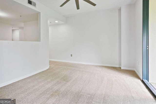 unfurnished room with light carpet and ceiling fan