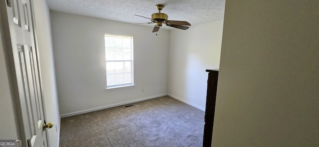 unfurnished room with carpet, a textured ceiling, and ceiling fan