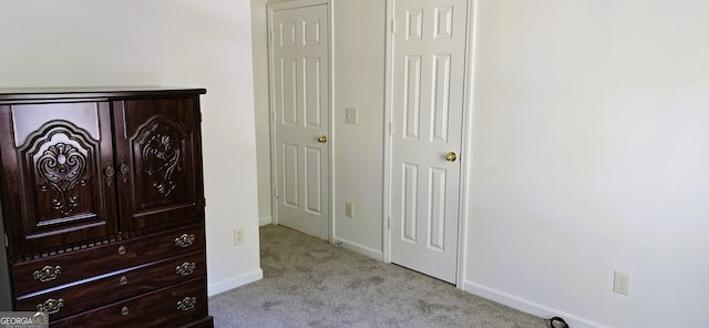 interior space featuring light carpet