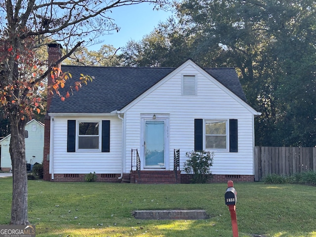 view of front of home with a front lawn