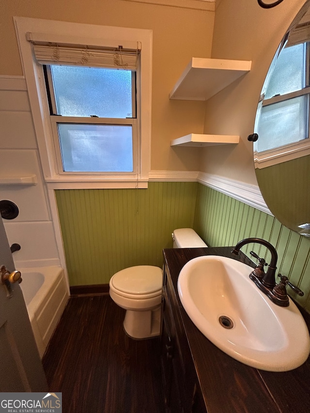 bathroom featuring vanity, hardwood / wood-style floors, and toilet