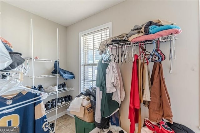 walk in closet featuring tile patterned flooring