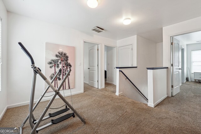 workout area with light colored carpet