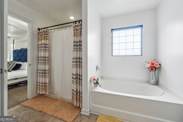 bathroom with independent shower and bath