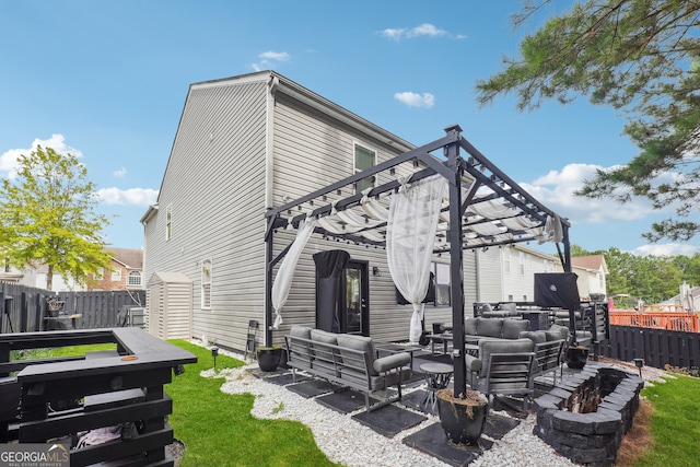 back of property with a pergola, a patio area, a yard, and an outdoor hangout area