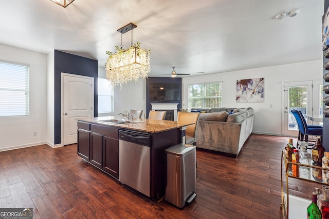 kitchen featuring a wealth of natural light, dishwasher, decorative light fixtures, and dark hardwood / wood-style flooring