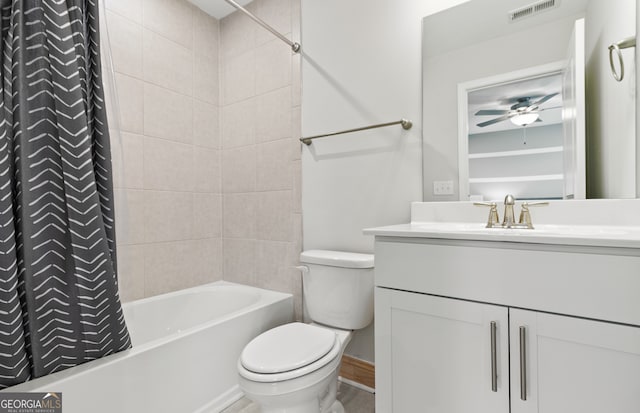 full bathroom with vanity, shower / bath combo, toilet, and ceiling fan