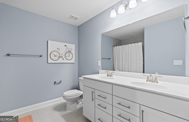 bathroom featuring toilet, walk in shower, vanity, and tile patterned flooring