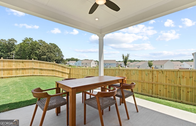 view of patio featuring ceiling fan