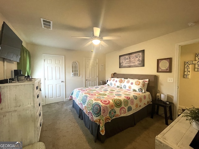 bedroom featuring dark carpet and ceiling fan