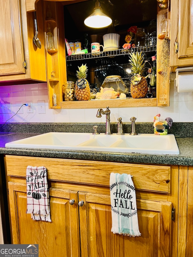 room details with decorative backsplash and sink