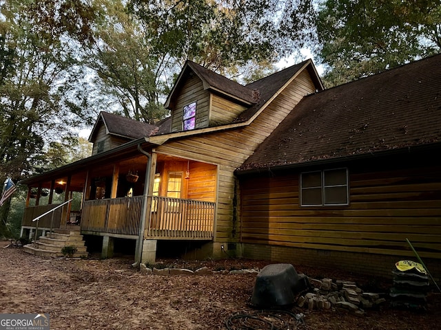 view of property exterior featuring a porch