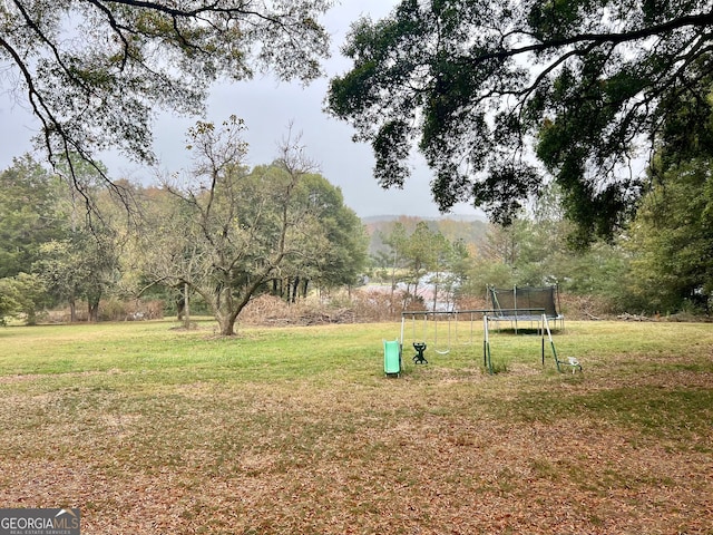 view of yard featuring a trampoline