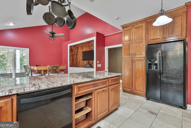 kitchen with black appliances, decorative light fixtures, high vaulted ceiling, light stone countertops, and ceiling fan