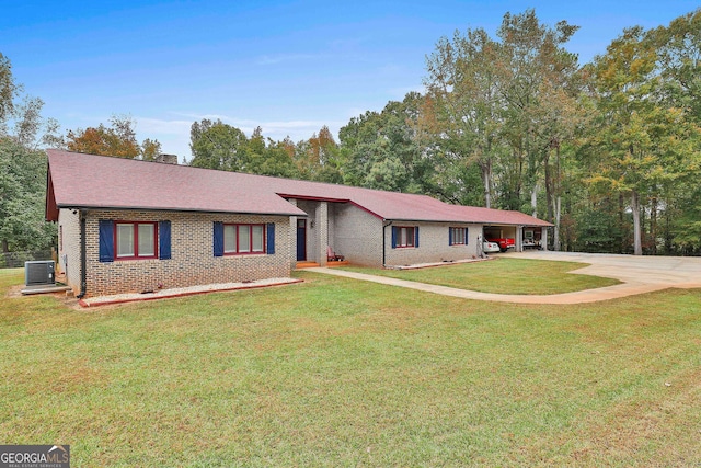 ranch-style home with central air condition unit and a front yard