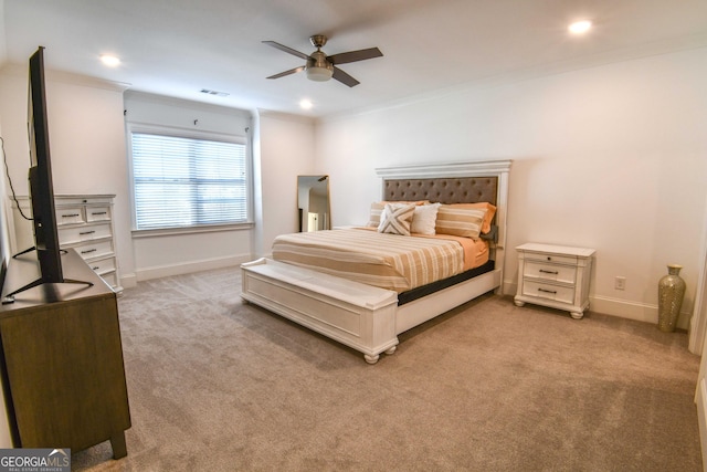 bedroom with light carpet, crown molding, and ceiling fan