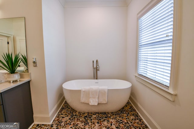 bathroom featuring a bathing tub and vanity