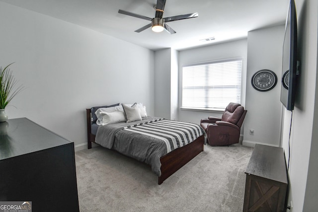 bedroom featuring ceiling fan and light colored carpet