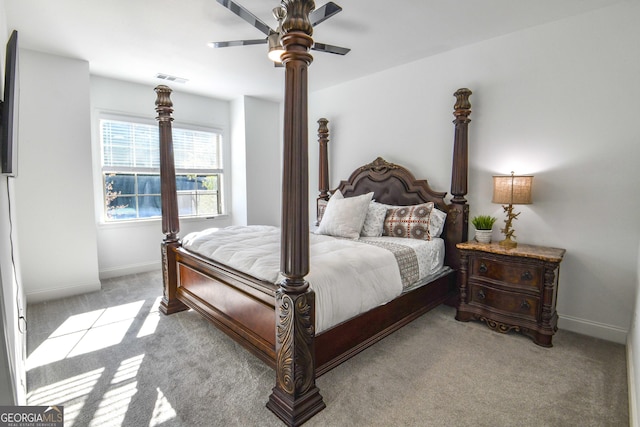 bedroom with light colored carpet and ceiling fan