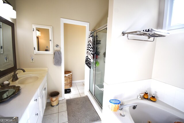 bathroom featuring vanity, shower with separate bathtub, and tile patterned floors