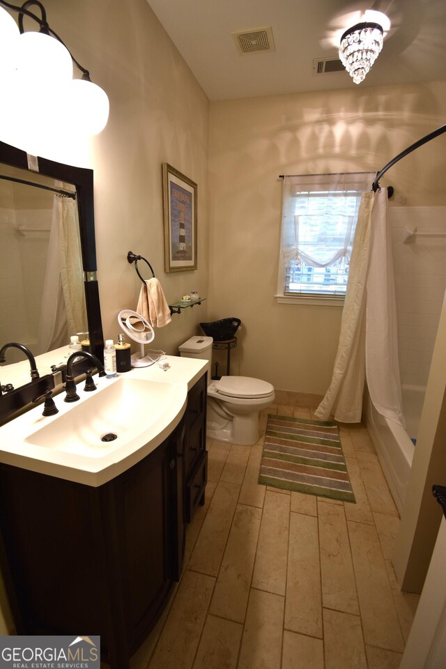 full bathroom with vanity, shower / tub combo with curtain, toilet, and wood-type flooring